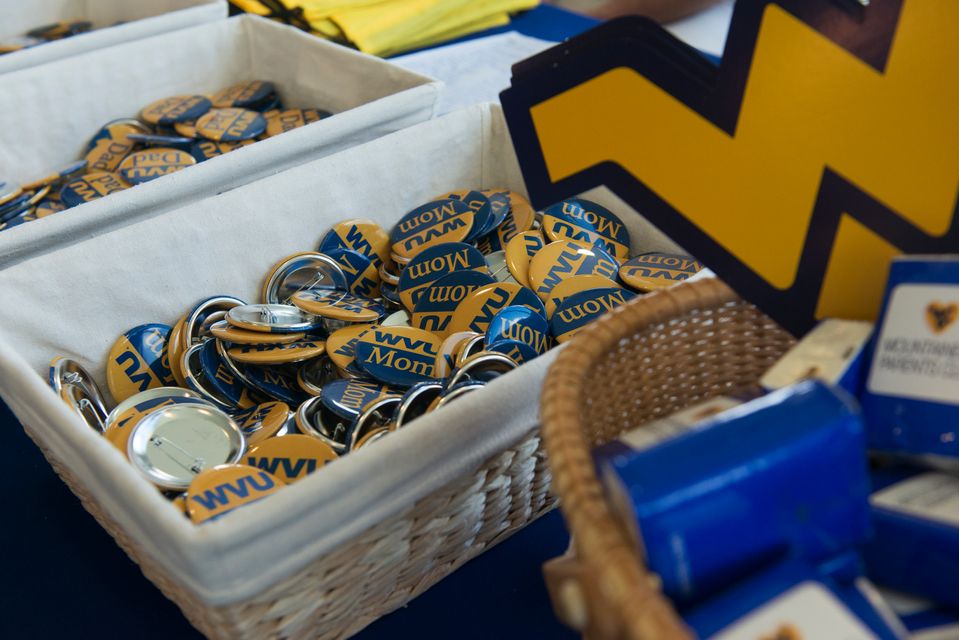 Two Baskets with WVU mom and dad buttons in them